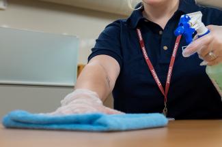 Cleaner wiping down table