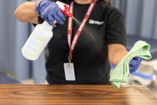 spraying on microfiber towel 